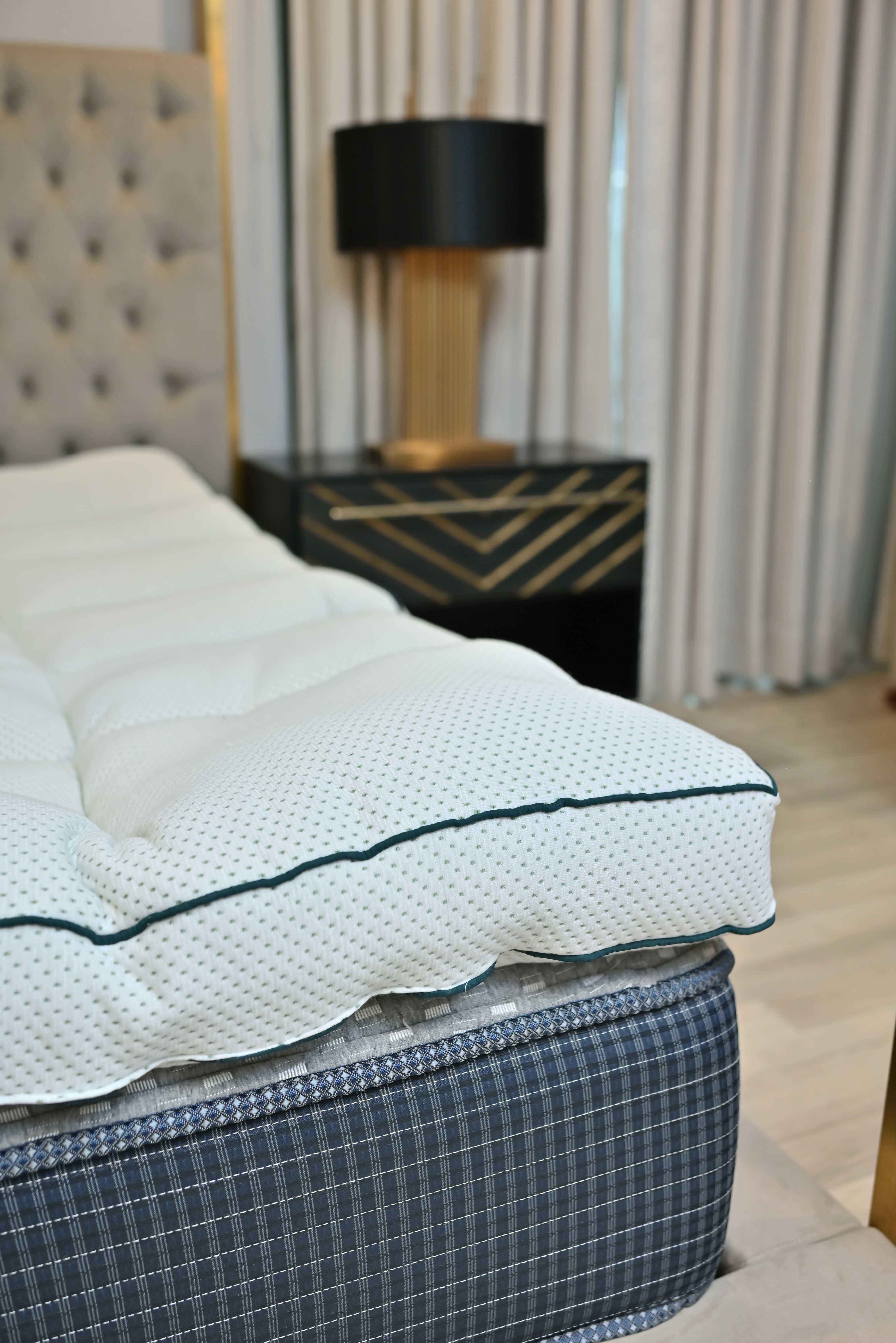 Mattress topper on a bed with a blurred background