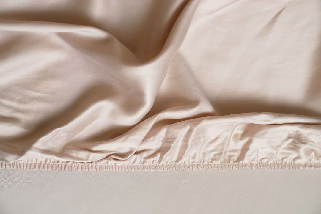 Close-up of beige fabric with a subtle texture