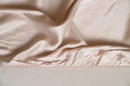 Close-up of beige fabric with a subtle texture