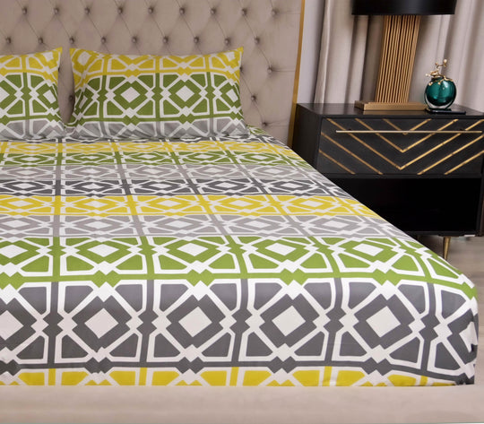 Bed with geometric patterned bedding, nightstand with decorative items, and tufted headboard.
